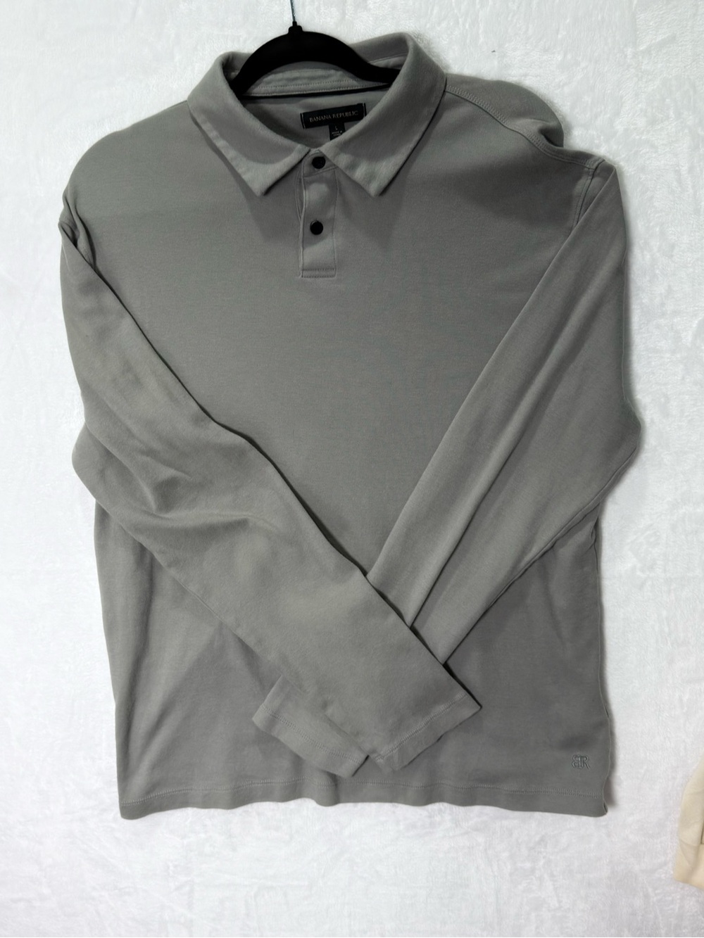 Banana Republic men’s long-sleeve polo shirt in a versatile medium gray. Feature